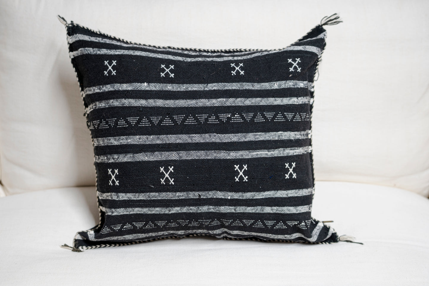 Black base and intricate white tribal-style patterns