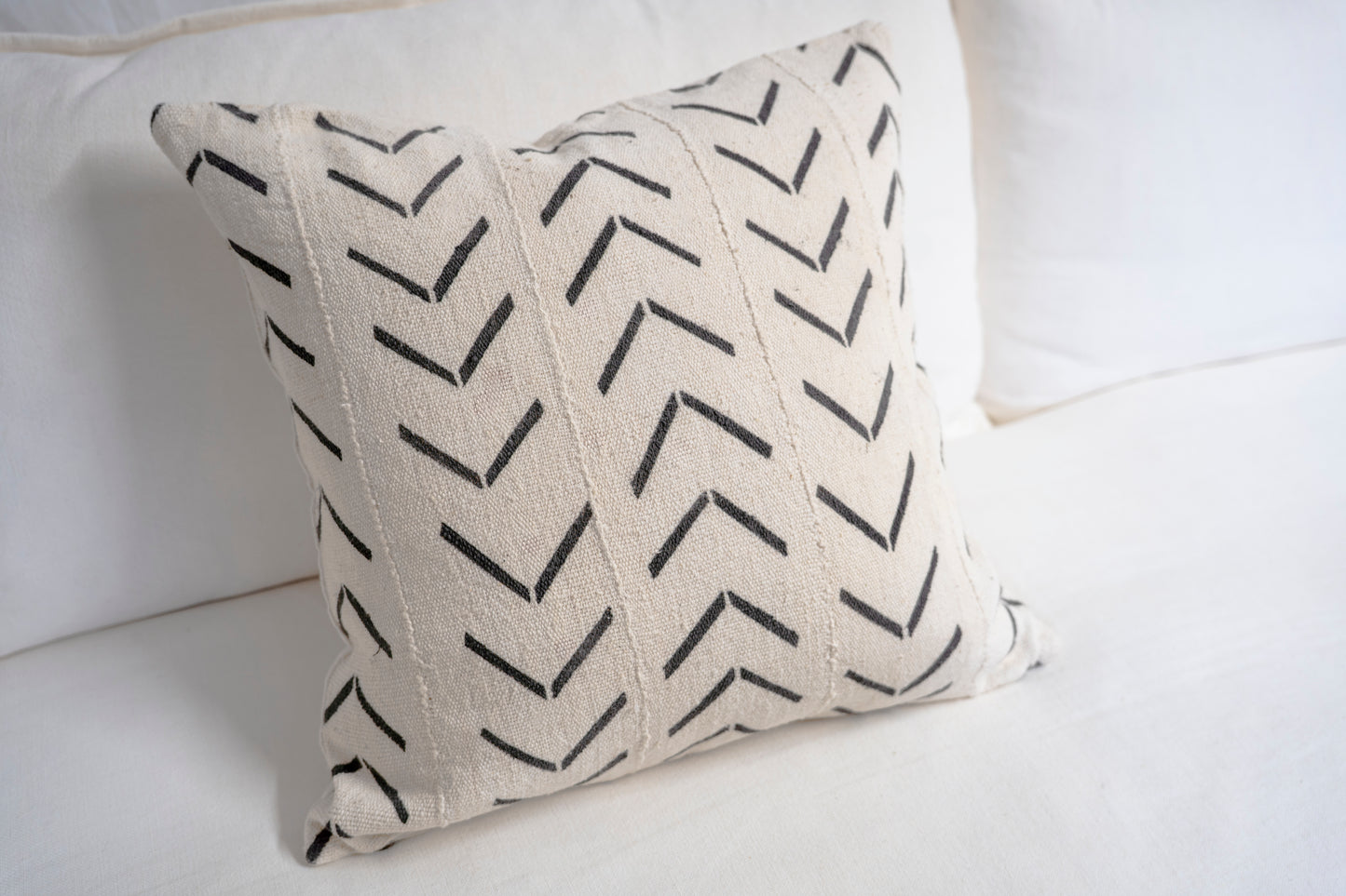 Cream-colored base and black chevron-style patterns