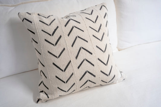 Cream-colored base and black chevron-style patterns