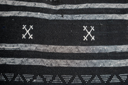 Black base and intricate white tribal-style patterns