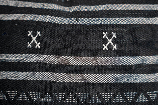 Black base and intricate white tribal-style patterns